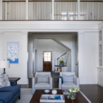 Coffee table, sofa, chairs, rug, and balcony