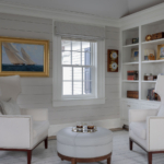 Sitting room with two chairs and bookshelves